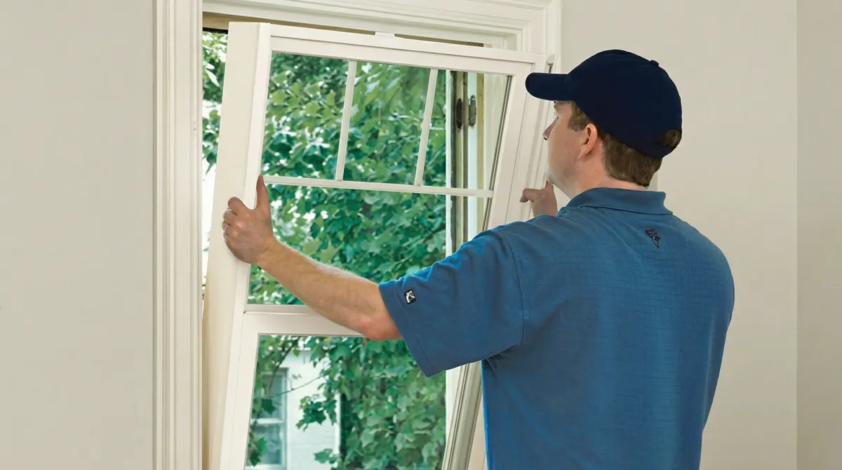 Professional contractors performing a residential window insulation and replacement service in Phoenix, AZ